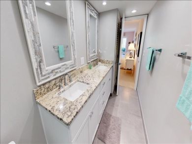 Just Steps to the Sandy Beach from this Two Bedroom Condo